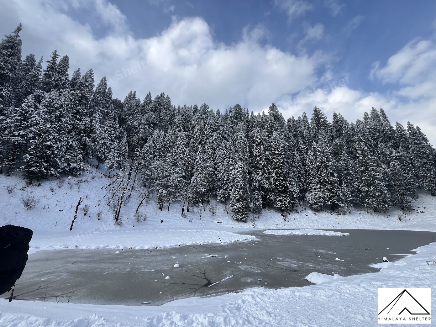 Walk on a frozen lake in Kedarkantha trek