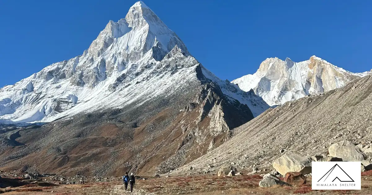 Trekkers Following The Trail With Meru Peak In The Front