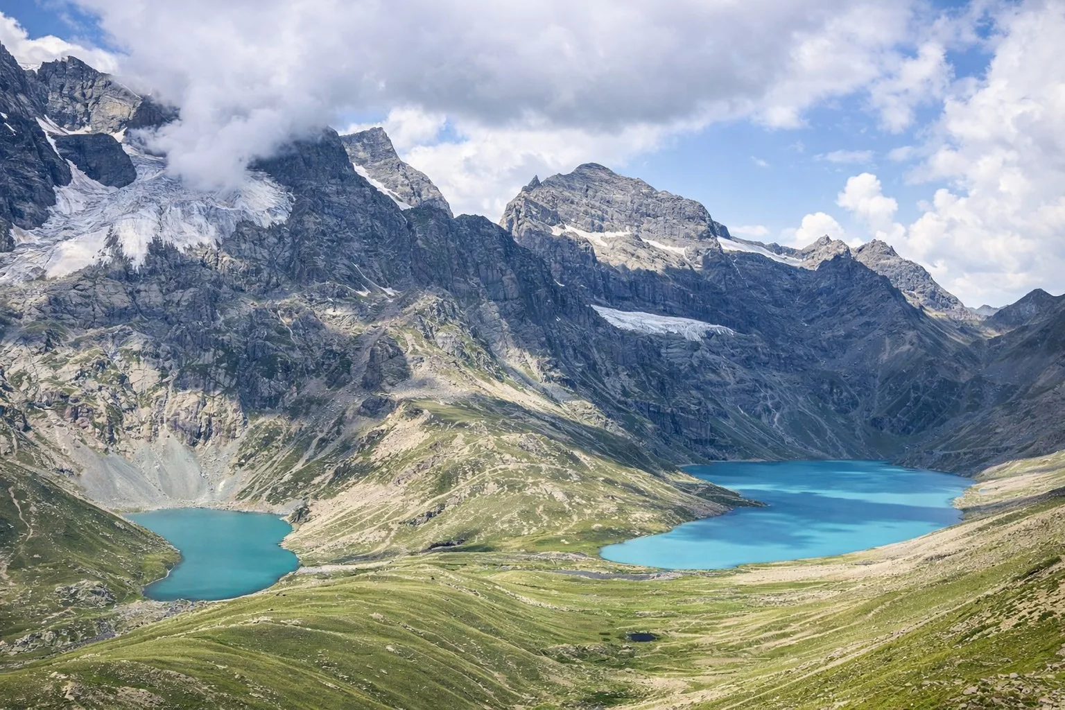 “Panoramic landscape of Kashmir Great Lakes Trek with mountains and meadow”