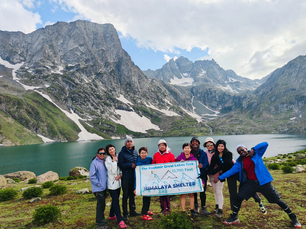 &ldquo;Kashmir Great Lakes Trek hikers walking through alpine valley and lake&rdquo;