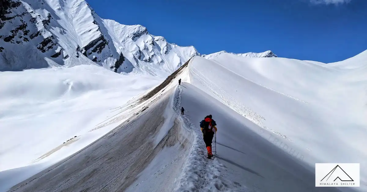 Trekkers Walking On The Connecting Ridge At Bali Pass