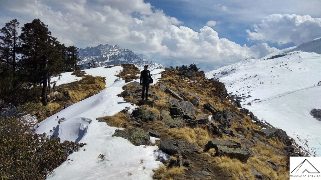 walking through the trail of kuari pass trek